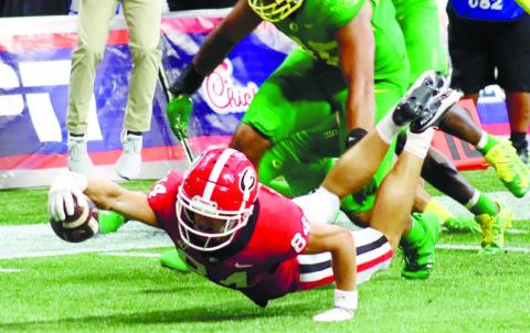 Bulldogs’ wide receiver Ladd McConkey (84) dives for the end zone in the first quarter of the Chick-fil-A Kickoff Classic. BRENDAN KOERNER/Staff