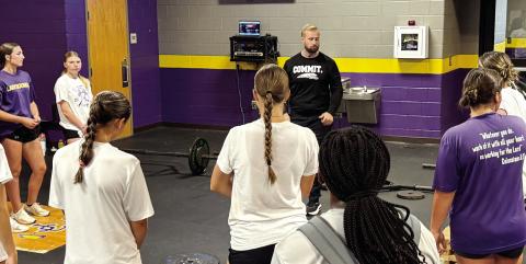 JCHS strength and conditioning coach Taylor Williams goes over the upcoming weight lifting regimen with the Lady Greyhounds during Monday morning’s off-season workouts. BRAD HARRISON/Staff