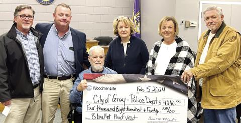 Woodmen Life present a check in the amount of $4,840 to the Gray Police Department for the purchase of eight bulletproof vests at the city’s Feb. 5 council meeting. Pictured (l-r) are: Heath Greene, GPD Chief Adam Lowe, Mayor Ed Barbee, Cissy Lamb and Teresa and Fred Allen. CONTRIBUTED