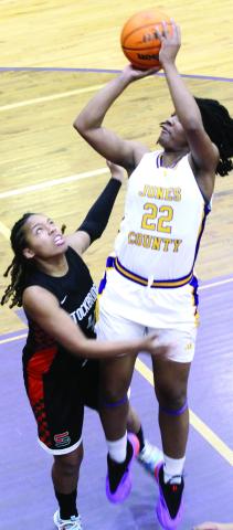 Kamiyah Adams fights for points in the paint against Stockbridge. BRAD HARRISON/Staff