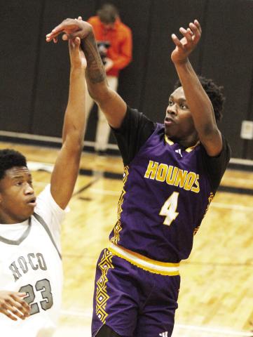 Kaden Douglas drains an outside jumper against Houston County. BRAD HARRISON/Staff