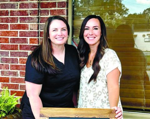 Anndrea Lampkin and Amber Asbell pose for a photo outside of Ambi Rae Boutique and Allure Beauty Bar.