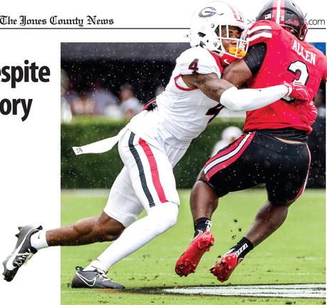 Georgia defensive back KJ Bolden takes down Western Kentucky’s Ajay Allen on the way to the Bulldogs’ 70-20 win. SKYLA MORRIS/Staff