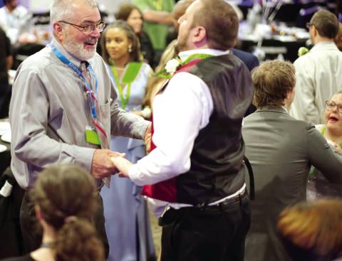 Jones County Commission Chairman Chris Weidner (left) was one of many volunteers at the Feb. 9 Night to Shine held at Bradley Baptist.