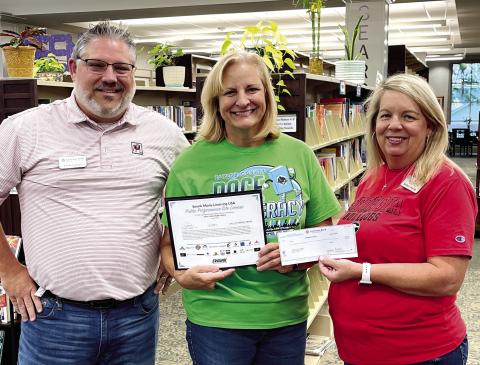 The Jones County Public Library is thankful to its community partner, Exchange Bank, for purchasing the movie license again for the next year. The funds were presented by Chris Gibson (left) and Barbara Merritt to library manager Julie King (center). This helps with the Book to Movie clubs, special needs programming, movie matinees and multiple programs throughout the year. CONTRIBUTED