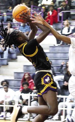 Mya Anderson drives hard to the basket against ELCA on her way to scoring 18 points for the Greyhounds. BRAD HARRISON/Staff