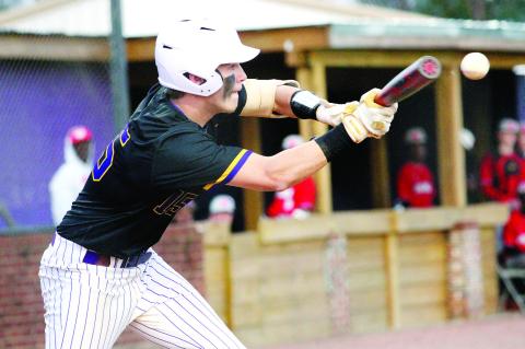 Cason Taylor lays down a bunt to advance the runner against Woodland. BRAD HARRISON/Staff