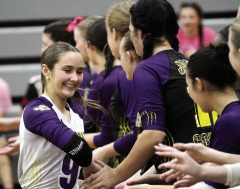 Isabella Bodnarchuk (9) and the Volley Hounds fire one another up during player introductions prior to Thursday’s match. BRAD HARRISON/Staff