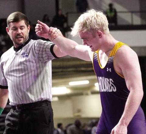 Arrie Martin’s hand is raised as the winner after winning a state championship on Saturday afternoon. BRAD HARRISON/Staff