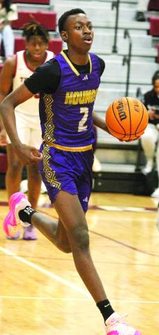 Rudy Bowden brings the ball up the floor against the Demons. BRAD HARRISON/Staff