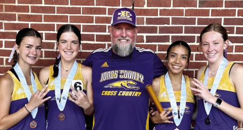 The Lady Greyhounds celebrate after their 4x800 relay team finished third in the state on Saturday. The relay team was comprised of Isabella Sanchez, Addison Robinson, Camryn Wommack, and Lilly Palmer. BRAD HARRISON/Staff