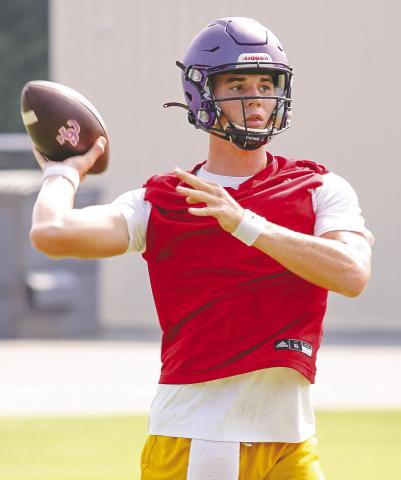 Quarterback Judd Anderson lets loose a pass during last week’s morning workouts. BRAD HARRISON/Staff