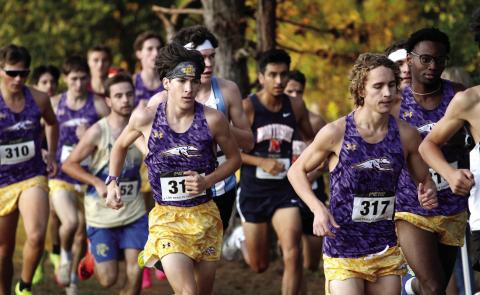 The Greyhounds lead the pack through one of the course’s early turns on the way to Saturday’s first-place finish in the Rancher’s Release The Hounds Invitational. BRAD HARRISON/Staff