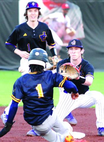 The Greyhounds spring into position to take the throw on a stolen-base attempt by Eagles Landing on Thursday. BRAD HARRISON/Staff