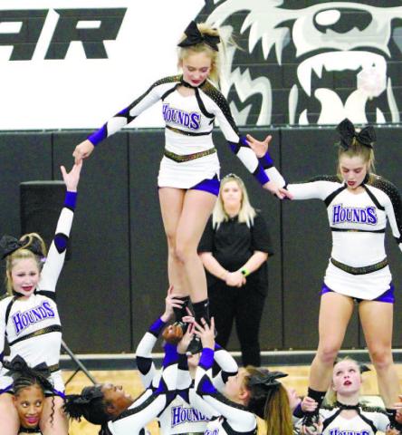 Jones County’s competition cheerleading squad executes a stunt during Saturday’s routine at the Middle Georgia Cheer Classic. BRAD HARRISON/Staff