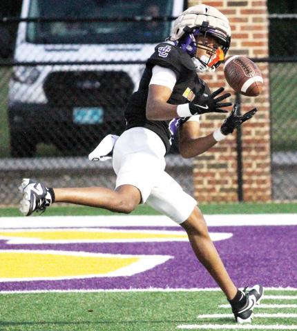 Jaivon Solomon hauls in a touchdown pass in perfect stride against Perry during the spring scrimmage. BRAD HARRISON/Staff