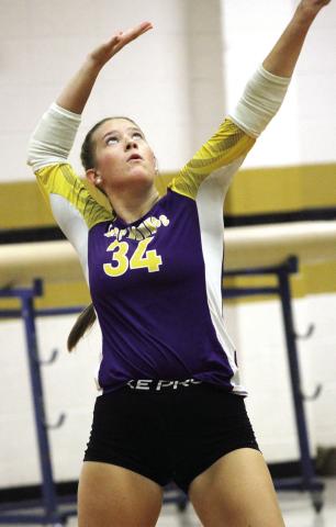 Lyndsie Hanner powers a serve to the opposing side of the court against Mary Persons. BRAD HARRISON/Staff