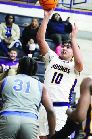 Tyler Wold fights his way toward the hoop for two points off of an offensive rebound. BRAD HARRISON/Staff