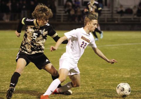 Brendan Waters (22) finds an angle to dribble the ball upfield on Friday at Mary Persons. BRAD HARRISON/Staff