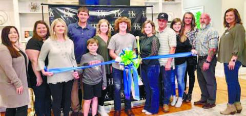 Tory Etheridge with TK Med Spa and the Chamber of Commerce holding the business’s ribbon cutting ceremony. CONTRIBUTED
