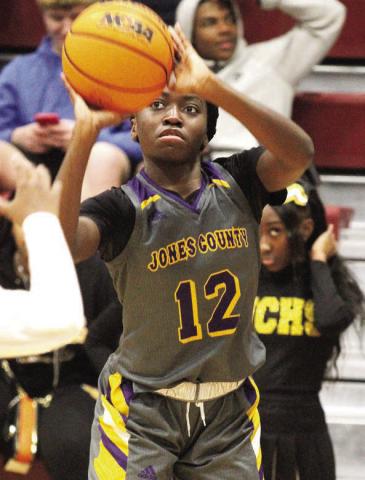 Mya Anderson drains a three pointer from the corner in the first half. against Warner Robins. BRAD HARRISON/Staff