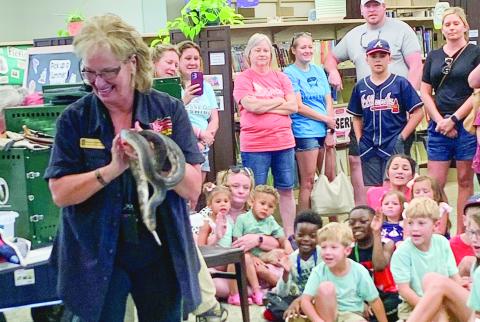A photo from last year’s summer reading program, where students got a chance to learn about snakes. CONTRIBUTED