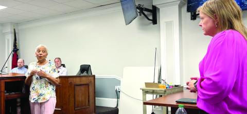 Audience member Pearl Solomon (left) had questions at the Commissioners May 21 meeting following a presentation by Board of Tax Assessors Chairman Leigh Stanford. DEBBIE LURIE-SMITH/Staff