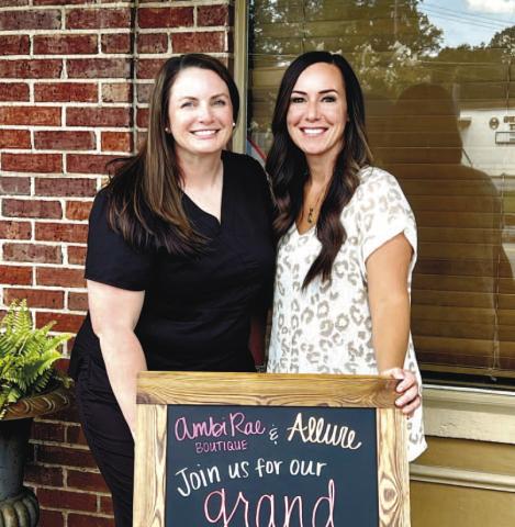 Anndrea Lampkin and Amber Asbell pose for a photo outside of Ambi Rae Boutique and Allure Beauty Bar.