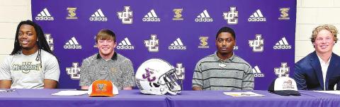 Four Greyhounds, Tucker Mix, Lamiron Solomon, Zyrique Earley and Evan West each formally signed scholarships last week. CONTRIBUTED