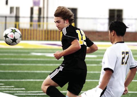Brandon Vickery moves into position to play the ball against Eagles Landing. BRAD HARRISON/Staff