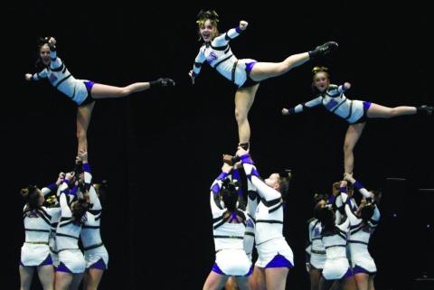 Jones County’s competition cheer squad performs its routine during Saturday’s GHSA State Cheerleading Championships at the Macon Coliseum. BRAD HARRISON/Staff