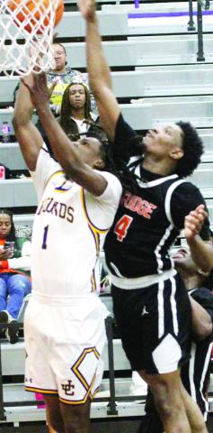 Sheldon Jackson fights his way in for two points against the Tigers. BRADLEY HARRISON/Staff