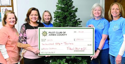 Representing the Pilot Club, Beth Coon, Fay Mathews, Nancy McCook, and Wanda Bush presented a check to Melody Kelly of the Department of Family and Children Services. The money will be used in supporting and assisting families during the Christmas season. We are thankful for this agency and the services they provide in our community. CONTRIBUTED