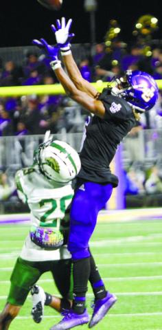Geo Wade goes up to haul in a pass on Friday against Ola. He had five catches for 65 yards on Friday. BRAD HARRISON/Staff