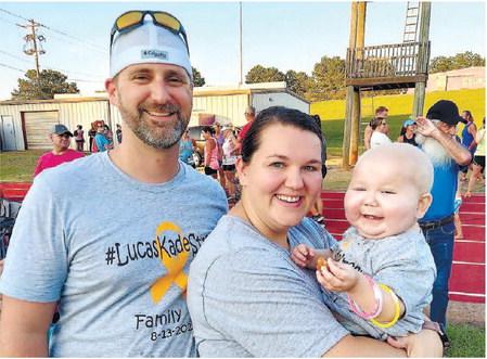 Lucas Messengale at the 5K race with his mother and father. CONTRIBUTED
