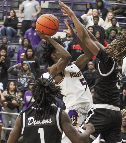 Jaden Stanley goes up and over Warner Robins to sink the game-winning shot against the Demons. BRAD HARRISON/Staff