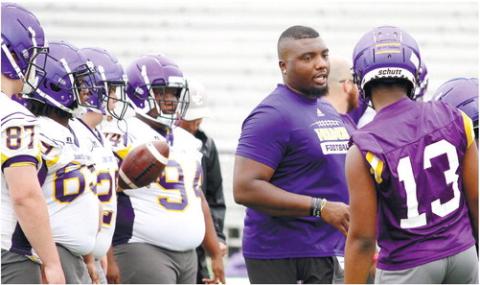 Greyhounds assistant coach Alexus Humphries gives instructions during one of last week’s practices at Greyhound Field. BRAD HARRISON/Staff