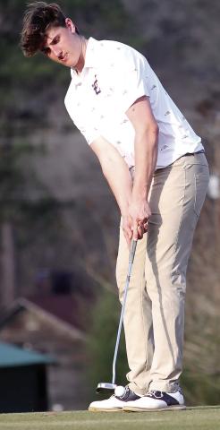 John Rackley lines up to putt during Thursday’s match against Houston County. BRAD HARRISON/Staff