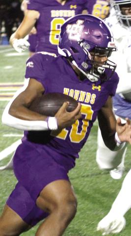 Kaden Canty runs upfield against the Wildcats’ defense. BRAD HARRISON/Staff