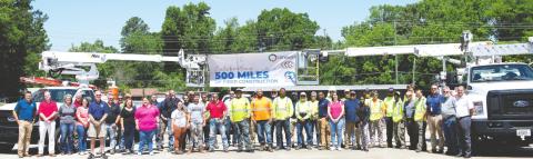 Tri-CoGo employees and contractors celebrate the 500th mile of fiber installed. CONTRIBUTED