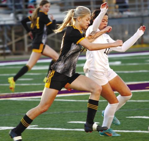 Daisy Blanton sprints toward the ball during last Tuesday’s game against Union Grove. BRAD HARRISON/Staff