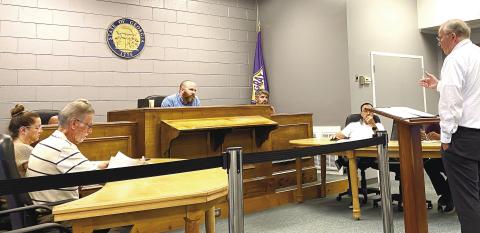 Donnie Melton speaks with council members Aug. 7 about his concerns of allowing alcohol consumption at city events. DEBBIE LURIE-SMITH/Staff