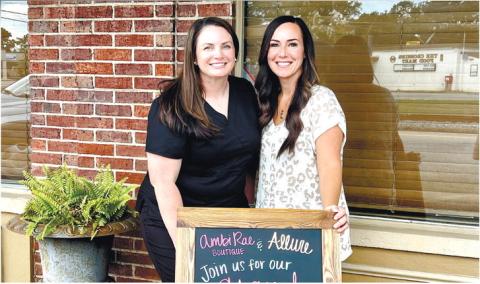 Anndrea Lampkin and Amber Asbell pose for a photo outside of Ambi Rae Boutique and Allure Beauty Bar. AMBER ASBELL/Contributed
