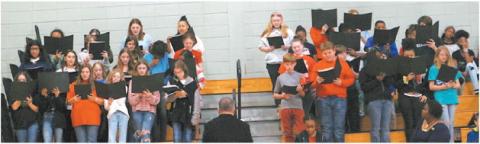 The Clifton Ridge Middle School chorus sings during the Veterans Day Ceremony for the crowd.