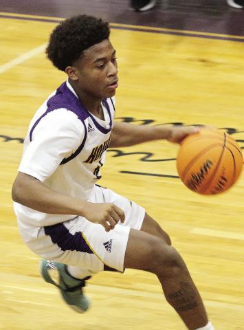 Chance Banks brings to ball up the floor for the Greyhounds during preseason action. JCHS opens region play Dec. 3 at McDonough. BRAD HARRISON/Staff