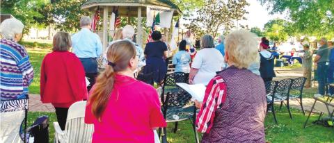 A crowd of locals gathered to pray at Carol’s Park at last year’s National Day of Prayer. CONTRIBUTED