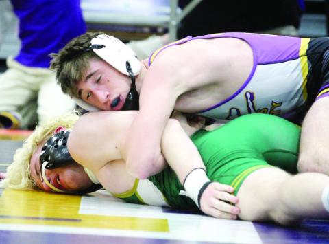 Nate McDaniel gains leverage against the opposition during Friday’s region tournament. BRAD HARRISON/Staff