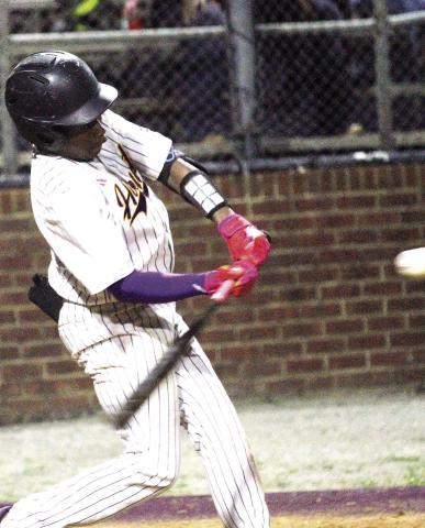 Micah Howard makes contact during the late innings on Thursday. BRAD HARRISON/Staff