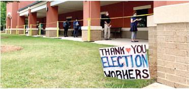 Voters wait in line at a precinct in Cobb County. (Photo by Beau Evans)