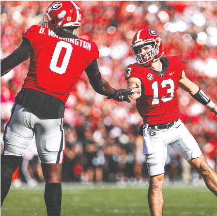 Georgia tight end Darnell Washington (0) led the team in receiving against Vanderbilt, making the most of opportunities from quarterback Stetson Bennett (13). TONY WALSH/UGA Athletics